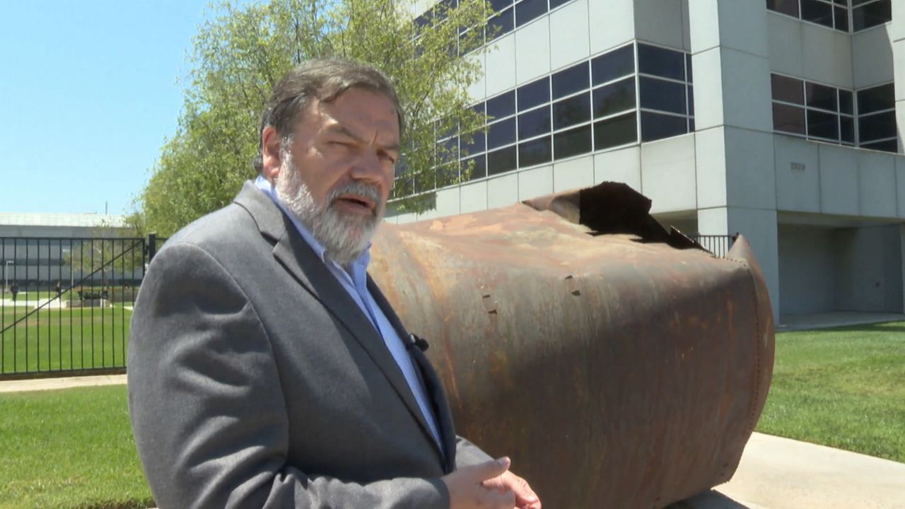 A man at a computer.
