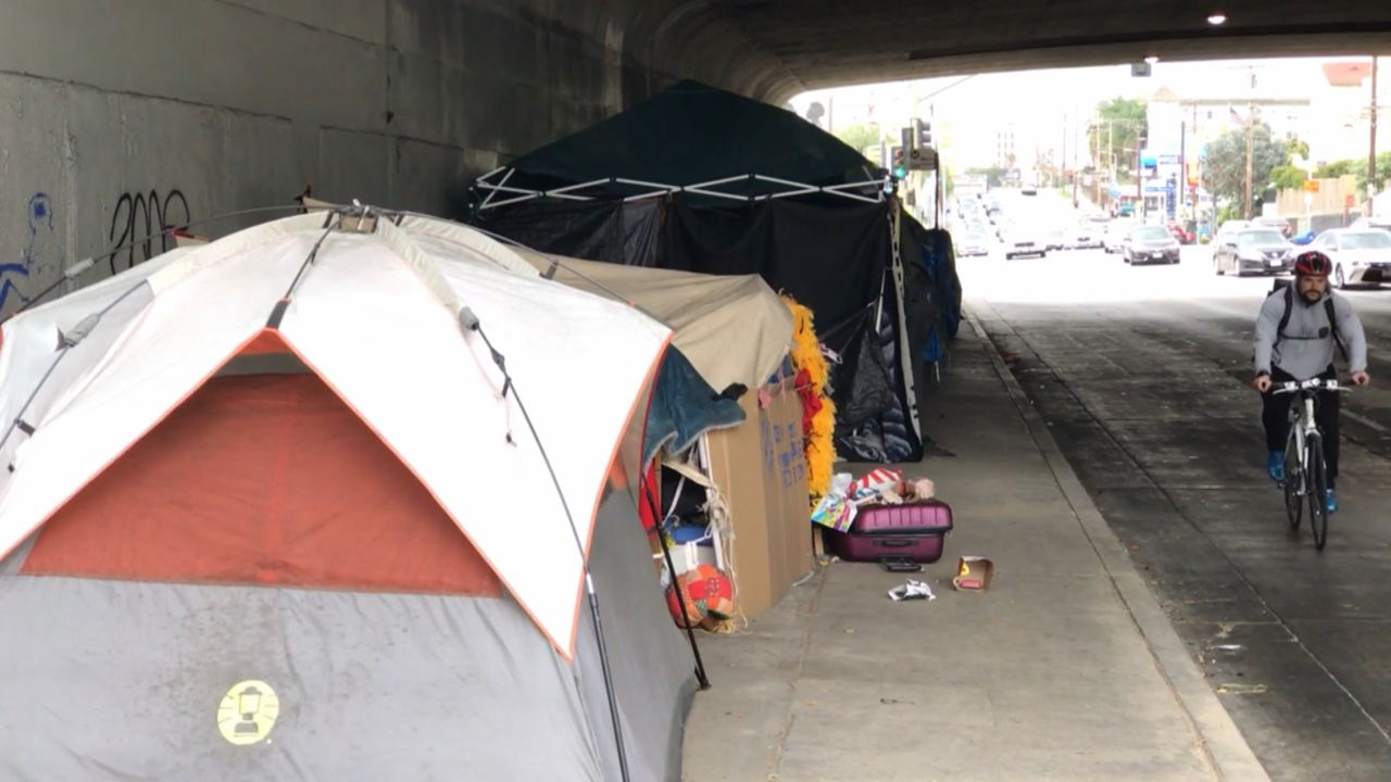 Emergency homeless shelters are opening early in LA County with a cold front bringing freezing rain and the possibility of snow in some areas.
