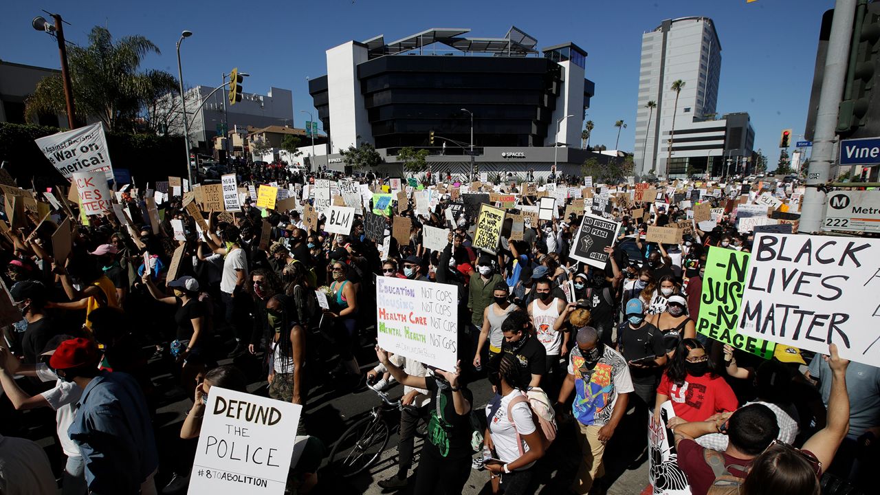 Demonstrators March Sunday in the Hollywood area of Los Angeles, during a protest over the death of George Floyd who died May 25 after he was restrained by Minneapolis police. 