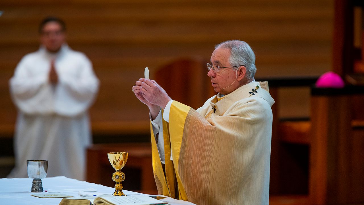 In this file photo from June 7, 2020, Archbishop Jose H. Gomez celebrates the Solemnity of the Most Holy Trinity, a Mass with churchgoers present at the Cathedral of Our Lady of the Angels in downtown Los Angeles. It was his first Mass since public Masses throughout the Archdiocese of Los Angeles were suspended on March 16 amid the COVID-19 pandemic. (AP Photo/Damian Dovarganes)