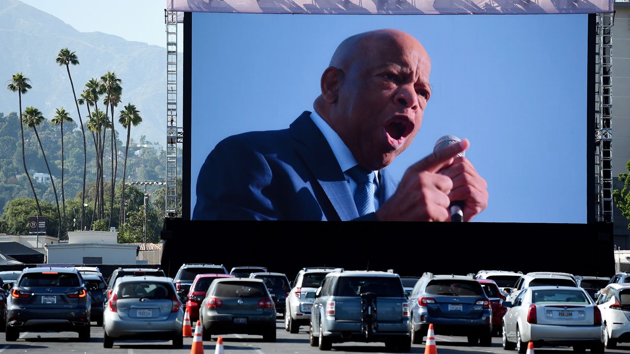 Rep. John Lewis, D-Ga., is seen onscreen in a scene from the documentary film "John Lewis: Good Trouble," on the opening night of the Tribeca Drive-In, Thursday at the Rose Bowl in Pasadena. (AP Photo/Chris Pizzello)