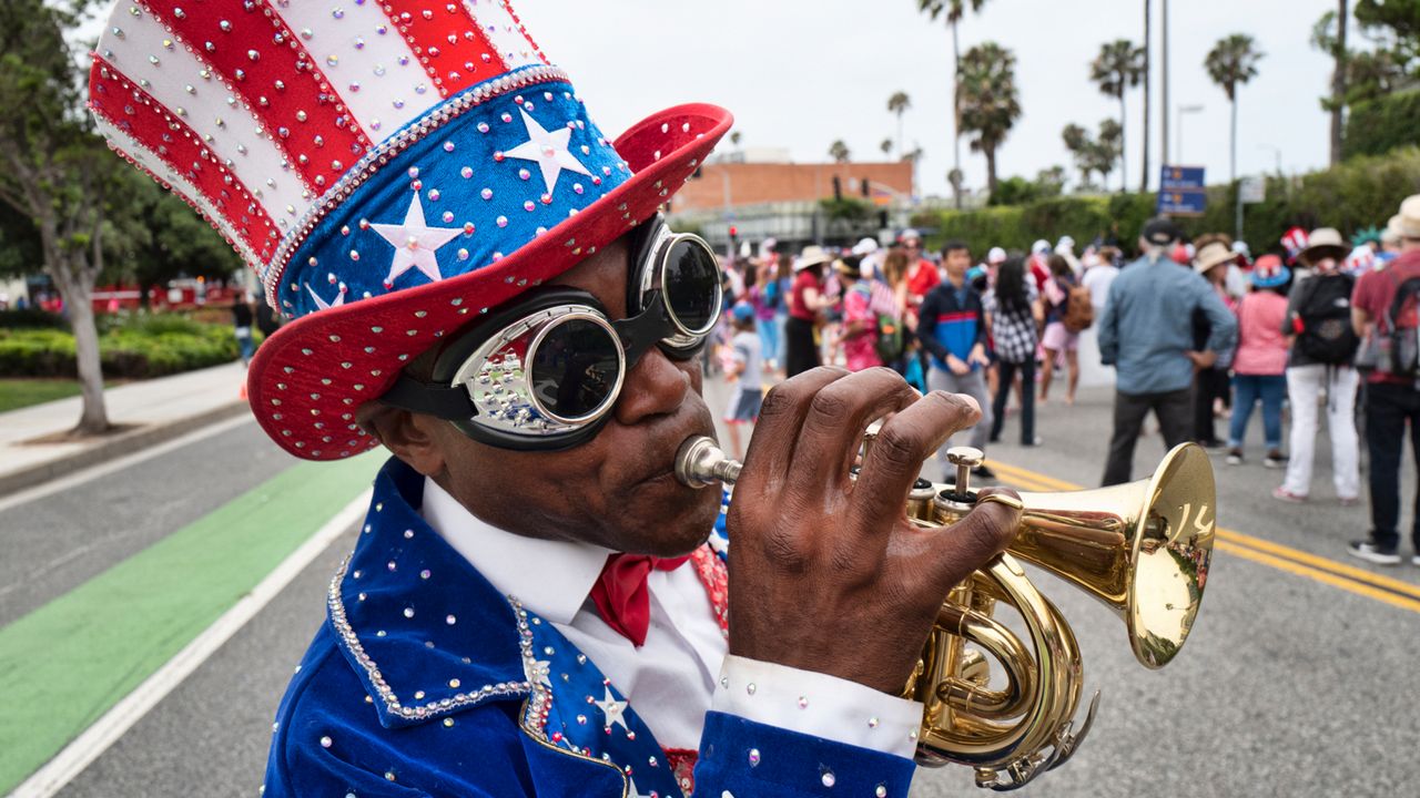 A trumpeter who went only by the name Lenny plays a tune during the Santa Monica Fourth of July parade on July 4, 2019, in Santa Monica. (AP Photo/Richard Vogel)