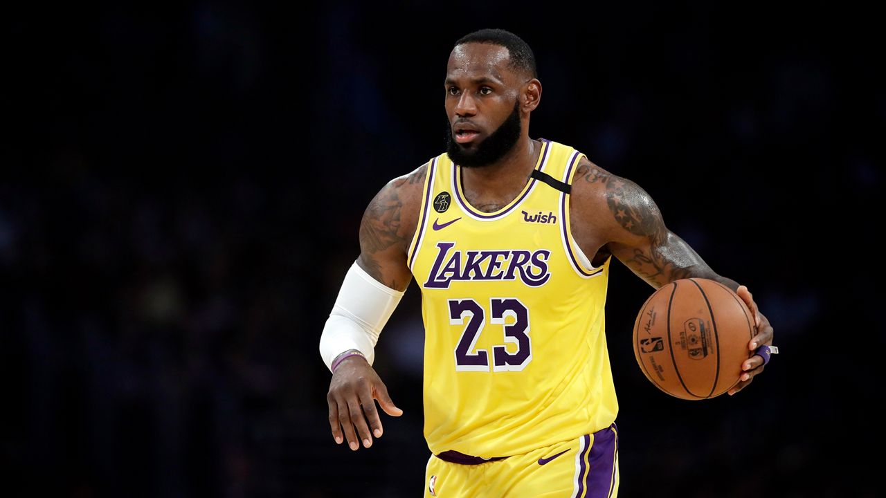 In this file photo from March 10, 2020, Los Angeles Lakers' LeBron James (23) dribbles during the first half of an NBA basketball game against the Brooklyn Nets in Los Angeles. (AP Photo/Marcio Jose Sanchez, File)