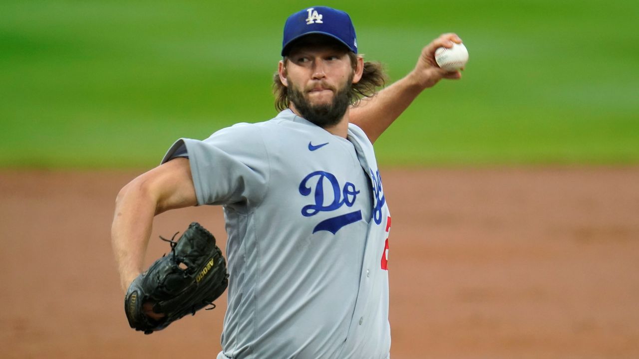 Los Angeles Dodgers starting pitcher Clayton Kershaw works against the Colorado Rockies during the first inning of a baseball game Saturday, Sept. 19, 2020, in Denver. (AP Photo/David Zalubowski)