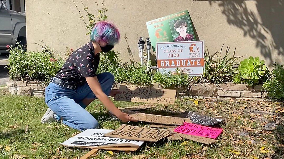Activist and her protest signs