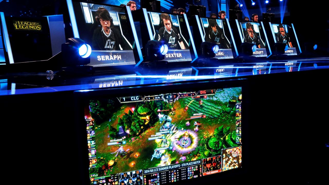 In this Aug. 29, 2014, file photo, gamers' names and faces are shown as they compete in a round of the League of Legends championship series video-game competition at the Penny Arcade Expo in Seattle. Big tech looks to hook gamers on a formula it says can boost energy and sharpen focus. (AP Photo/Ted S. Warren, File)