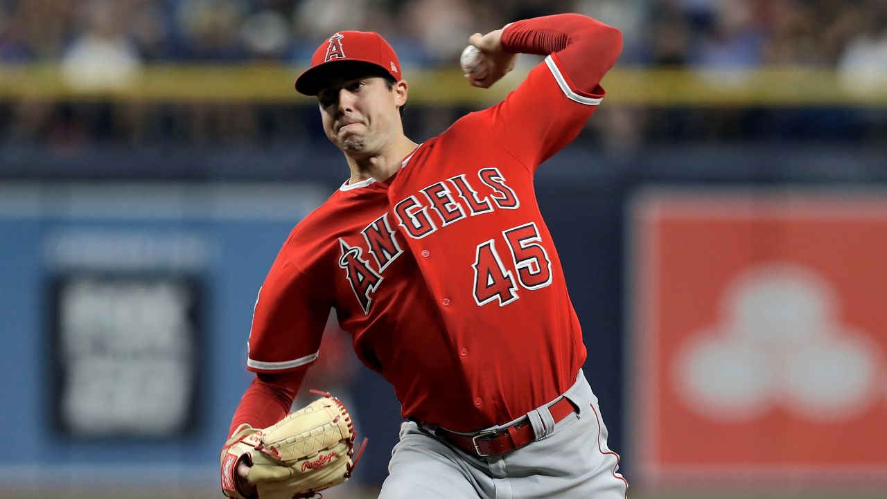 In this June 13, 2019 file photo Los Angeles Angels' Tyler Skaggs pitches to the Tampa Bay Rays during the first inning of a baseball game in St. Petersburg, Fla. Tyler Skaggs has died at age 27, Monday, July 1, 2019. Skaggs started the Angels' game Saturday night against the Athletics. Their game against the Texas Rangers on Monday night has been postponed. (AP Photo/Chris O'Meara, file)