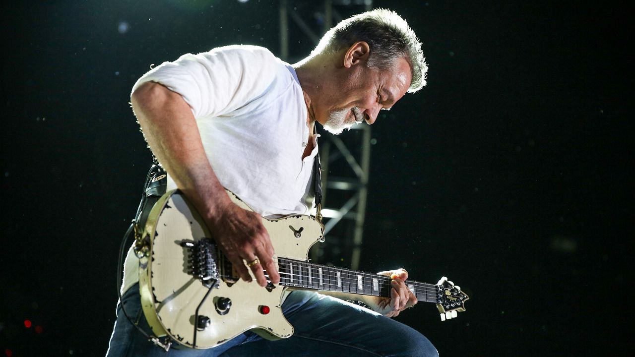 Eddie Van Halen of Van Halen performs at the Irvine Meadows Amphitheatre on Tuesday, July 14, 2015, in Irvine, Calif. (Photo by Rich Fury/Invision/AP)