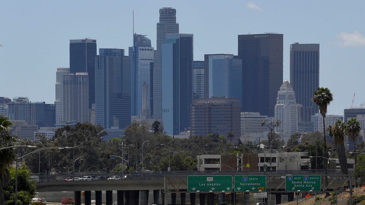 In this May 19, 2020 file photo, traffic moves along Interstate 10 as downtown Los Angeles is seen in the background in Los Angeles. (AP Photo/Mark J. Terrill,File)