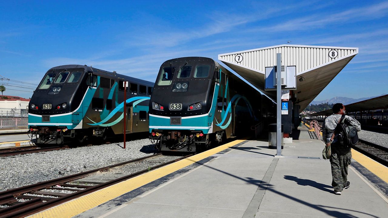 In this Feb. 25, 2015, file photo, Metrolink commuter trains stand at a platform at Union Station in downtown Los Angeles. (AP Photo/Nick Ut)