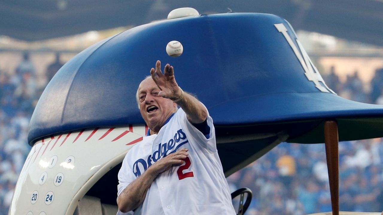 Former Los Angeles Dodgers' manager Tommy Lasorda throws out the first pitch before Game 3 of the World Series against the Boston Red Sox in Los Angeles on Oct. 26, 2018. (Eugene Garcia/Pool Photo via AP)