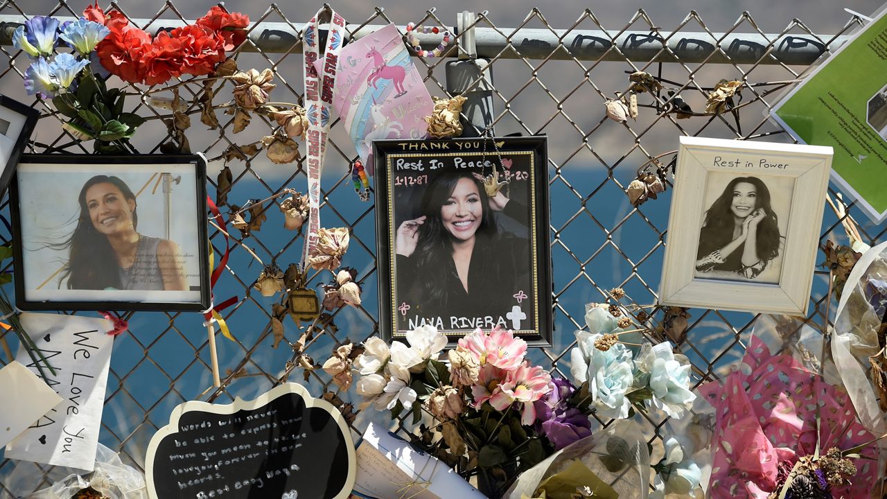 A makeshift memorial for the late actress Naya Rivera is pictured at Lake Piru, Monday, Aug. 3, 2020, in Los Padres National Forest, Calif., about 55 miles (90 kilometers) northwest of Los Angeles. The 33-year-old "Glee" star was found dead in Lake Piru on July 13, five days after her son, Josey, was found alone on a boat the two had rented there. (AP Photo/Chris Pizzello)