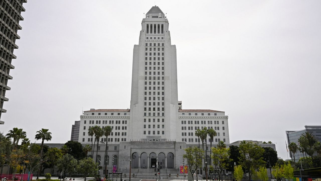 In this file photo from March 31, 2020, Los Angeles City Hall is seen in the distance. The City Council voted earlier this month to use $50 million in COVID-19 relief funds to help struggling Department of Water and Power customers. (AP Photo/Mark J. Terrill)