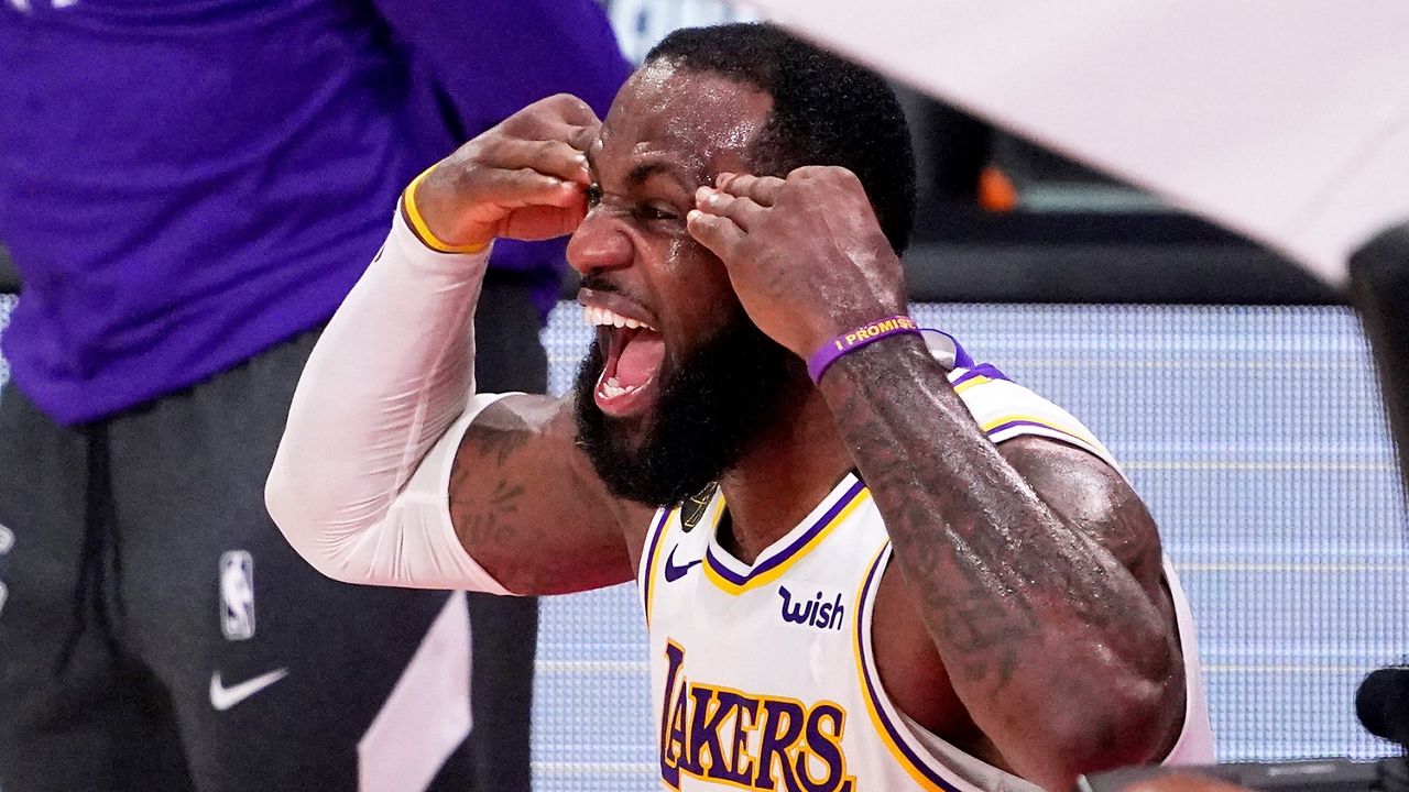 Los Angeles Lakers' LeBron James (23) celebrates after the Lakers defeated the Miami Heat 106-93 in Game 6 of basketball's NBA Finals Sunday, Oct. 11, 2020, in Lake Buena Vista, Fla. (AP Photo/Mark J. Terrill)