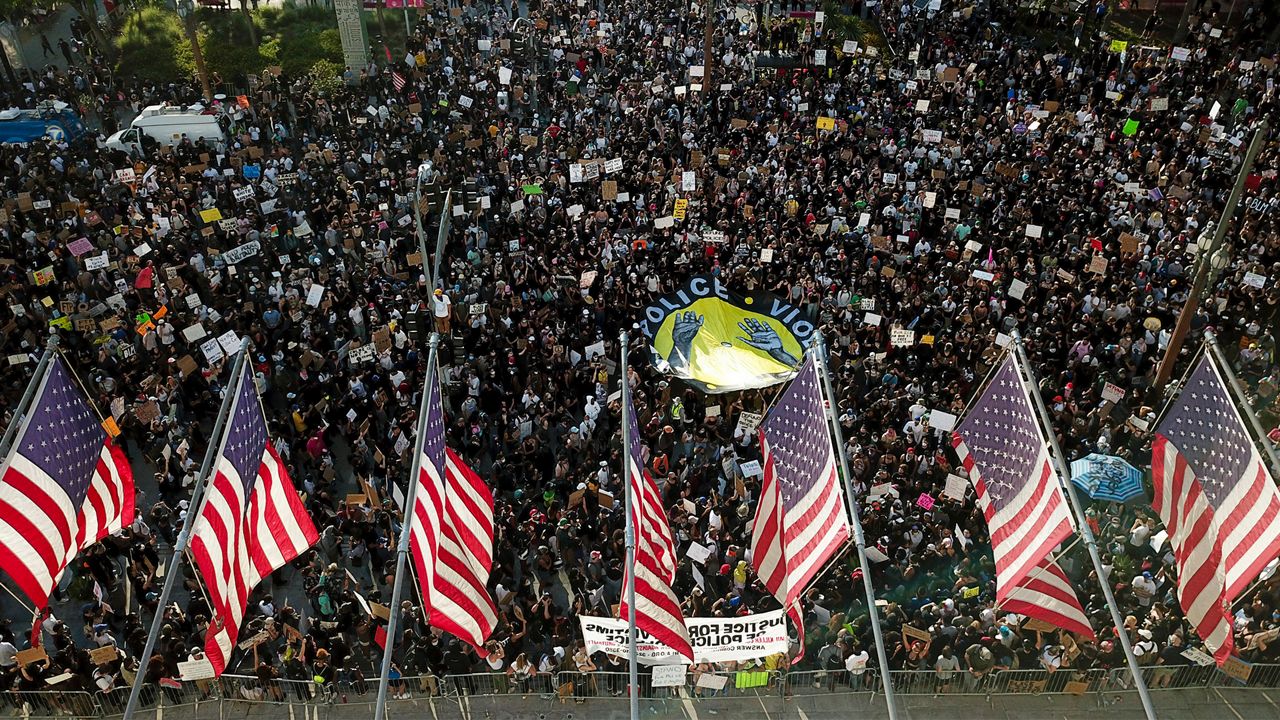 Demonstrators take part in a protest over the death of George Floyd who died May 25 after he was restrained by Minneapolis police, Wednesday, June 3, 2020, in downtown Los Angeles. (AP Photo/Ringo H.W. Chiu)