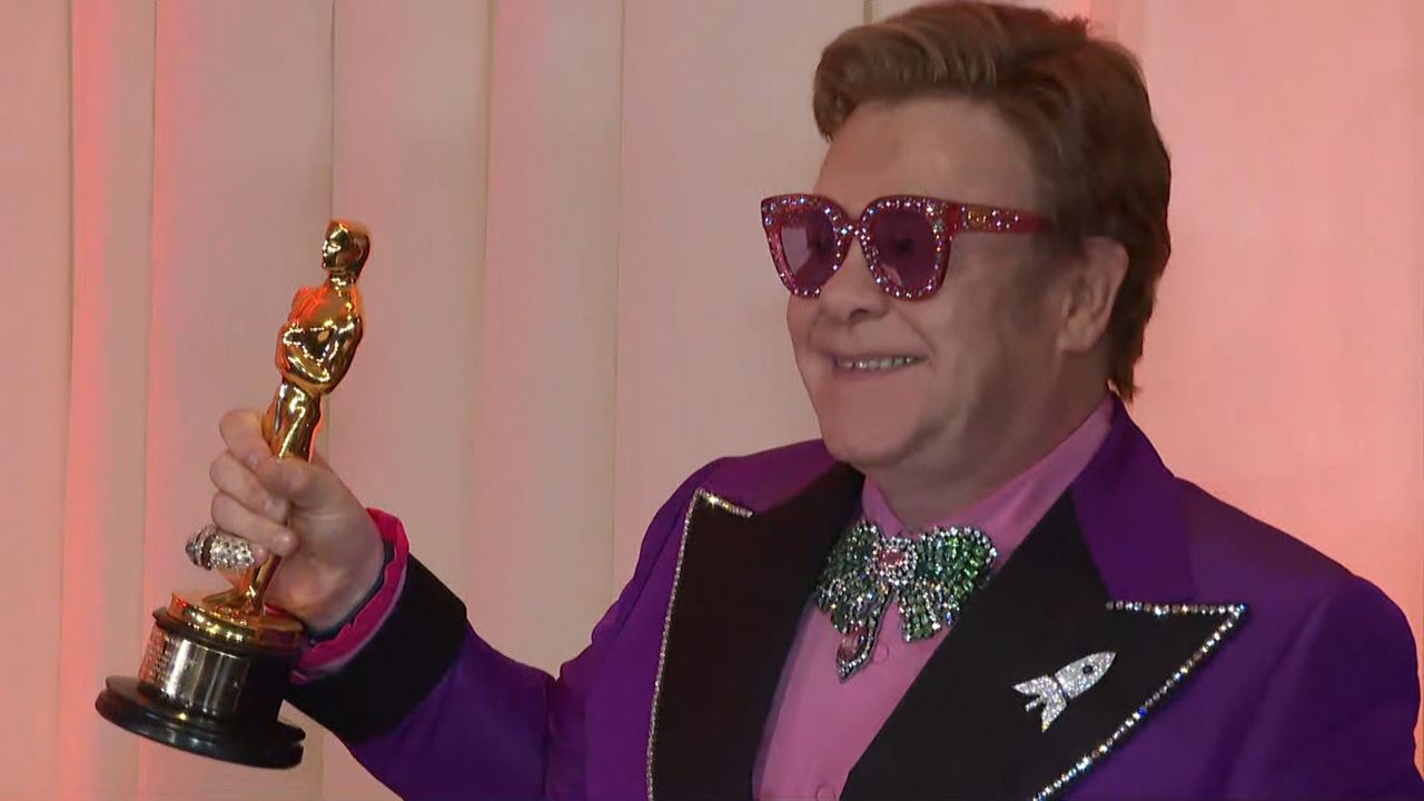 Elton John Wins Oscar While Raising Millions for Charity