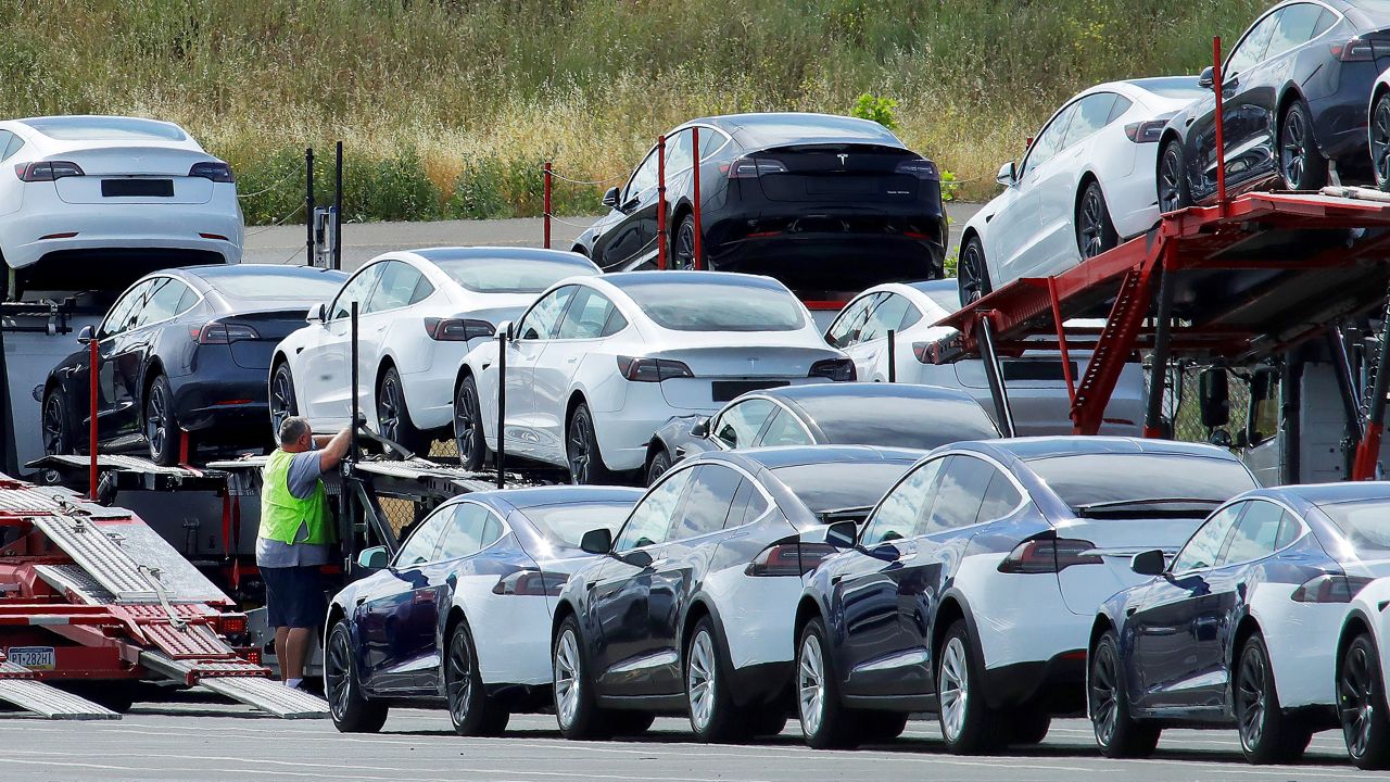 In this May 13, 2020, file photo, Tesla cars are loaded onto carriers at the Tesla electric car plant in Fremont. California Gov. Gavin Newsom said Sept. 23 that the state will halt sales of new gasoline-powered passenger cars and trucks by 2035. (AP Photo/Ben Margot, File)