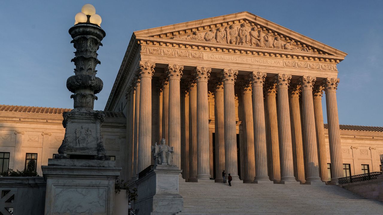 In this Friday, Nov. 6, 2020 file photo, The Supreme Court is seen at sundown in Washington. The Supreme Court is telling California it can't enforce a ban on indoor church services because of the coronavirus pandemic. The high court issued orders late Friday, Feb. 5, 2021 in two cases where churches had sued over coronavirus-related restrictions in the state. (AP Photo/J. Scott Applewhite, File)