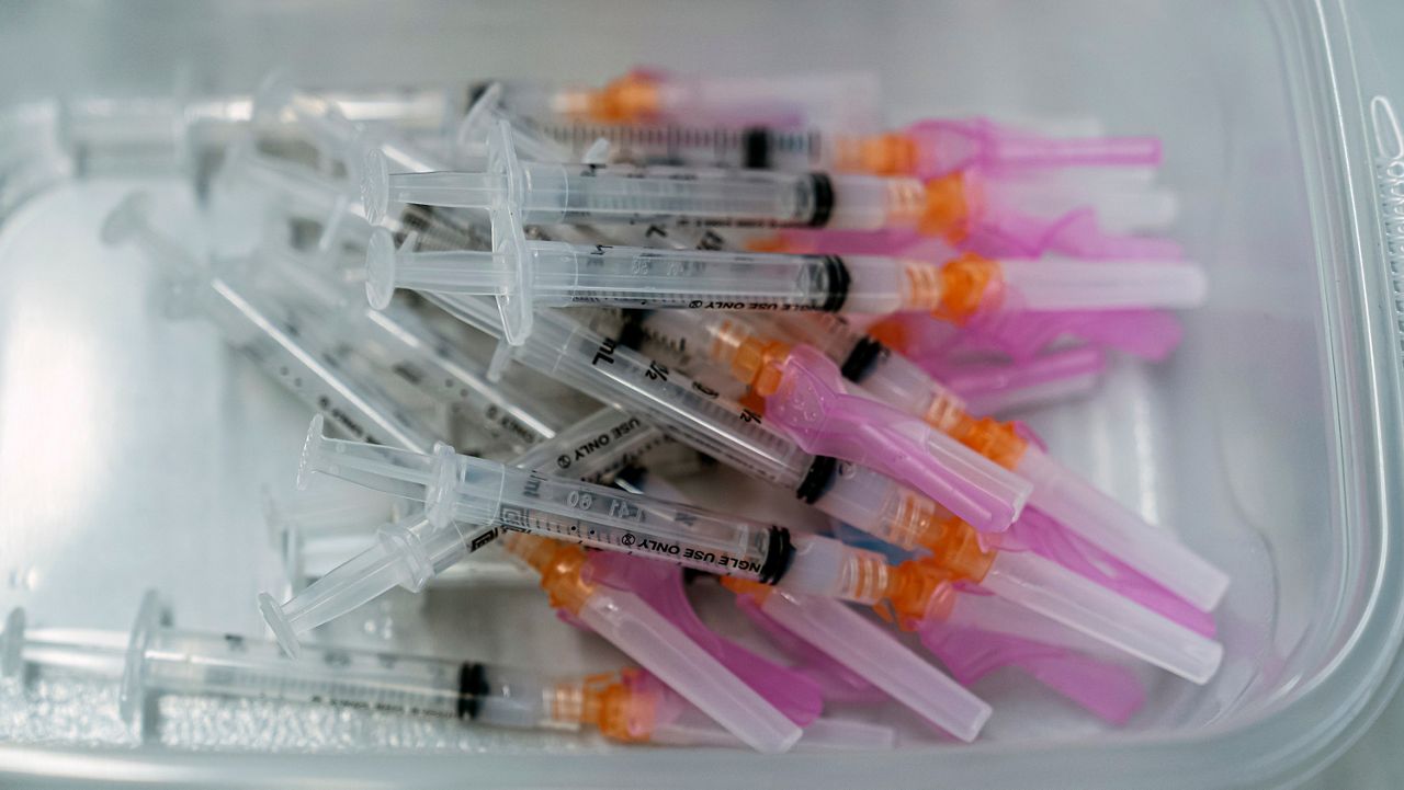 In this March 5, 2021, file photo, a batch of syringes filled with Moderna COVID-19 vaccines are ready for inoculations at a COVID-19 mobile vaccination clinic at the Pomona Fairplex in Pomona. (AP Photo/Damian Dovarganes)