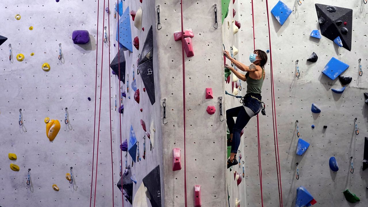 Angeline Loustau works out Wednesday at The Stronghold Climbing Gym after reopening amid the COVID-19 pandemic in Los Angeles. (AP Photo/Marcio Jose Sanchez)