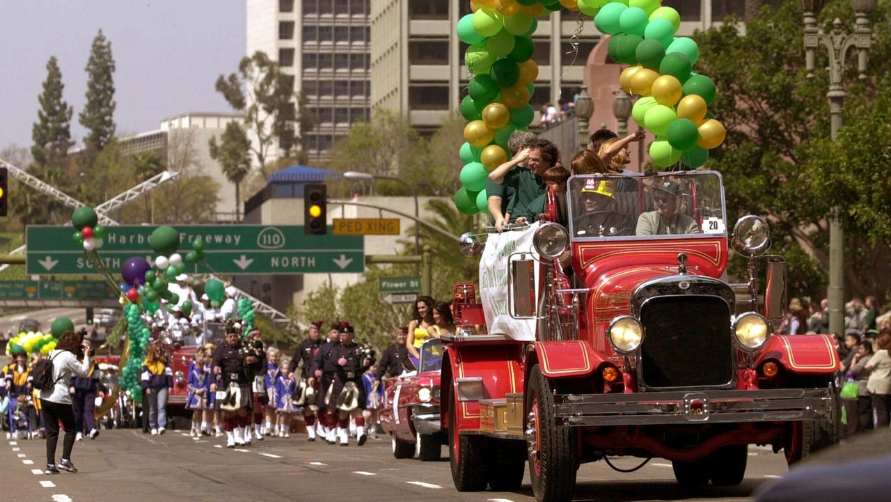 In this March 16, 2001, file photo, an old Los Angeles City Fire truck leads the way as the city's fire and police departments host their second annual St. Patrick's Day Parade in downtown Los Angeles. (AP Photo/Nick Ut)
