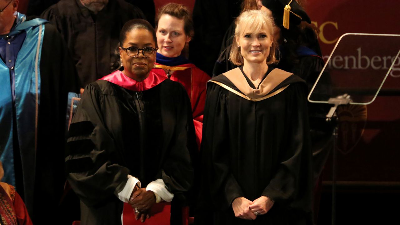 In this May 11, 2018, file photo, Oprah Winfrey, left, and Dean Willow Bay attend the USC Annenberg Class of 2018 graduation ceremony at the Shrine Auditorium in Los Angeles. (Photo by Willy Sanjuan/Invision/AP)