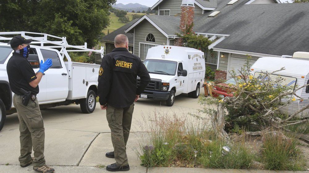 Investigators with the San Luis Obispo County Sheriff Department returned to the house of Reuben Flores Tuesday in Arroyo Grande, Calif. (David Middlecamp/The Tribune (of San Luis Obispo) via AP)