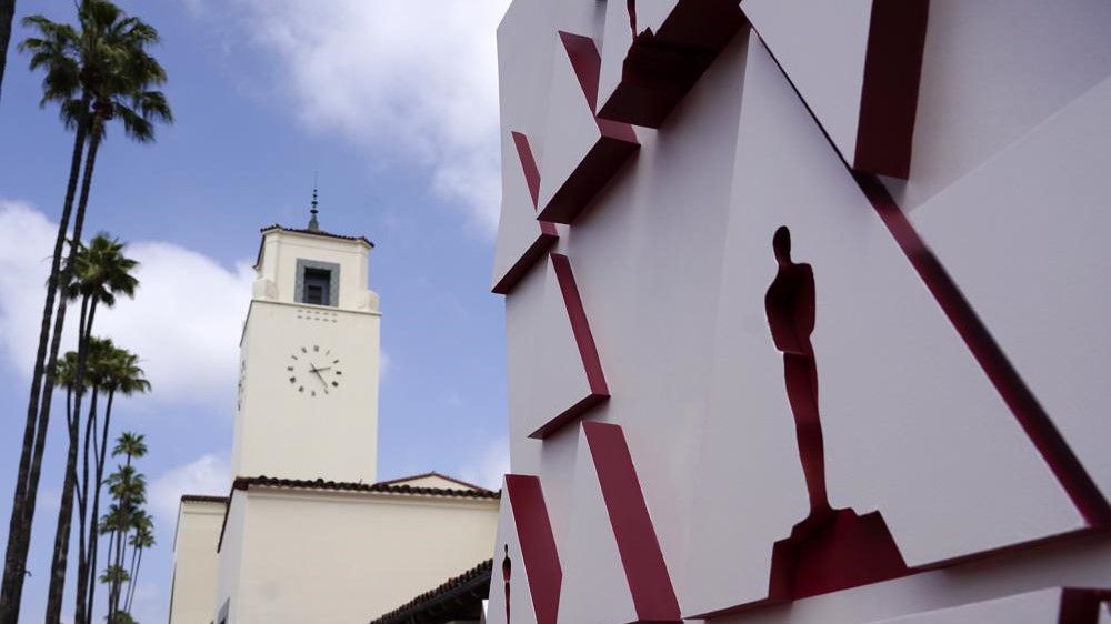 An Oscar statue design on a red carpet backdrop is pictured at Union Station, one of the locations for Sunday's 93rd Academy Awards in Los Angeles. (AP Photo/Chris Pizzello, Pool)