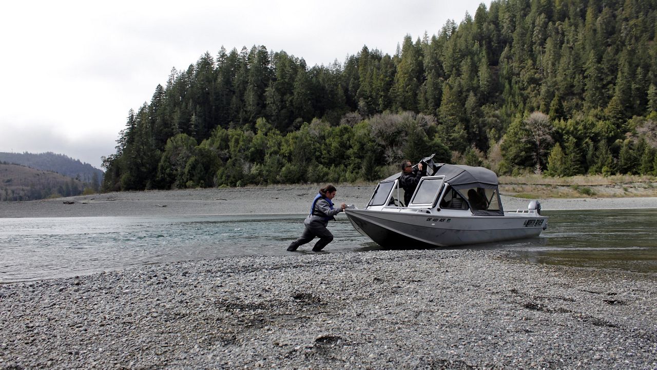 n this March 5, 2020, file photo, Hunter Maltz, a fish technician for the Yurok tribe, pushes a jet boat into the low water of the Klamath River at the confluence of the Klamath River and Blue Creek as Keith Parker, as a Yurok tribal fisheries biologist, watches near Klamath, Calif., in Humboldt County. Democrats in the California Senate on Thursday, April 29, 2021, detailed a $3.4 billion proposal designed to gird the state for a new crisis on the heels of a deadly and disruptive pandemic. (AP Photo/Gillian Flaccus, File)