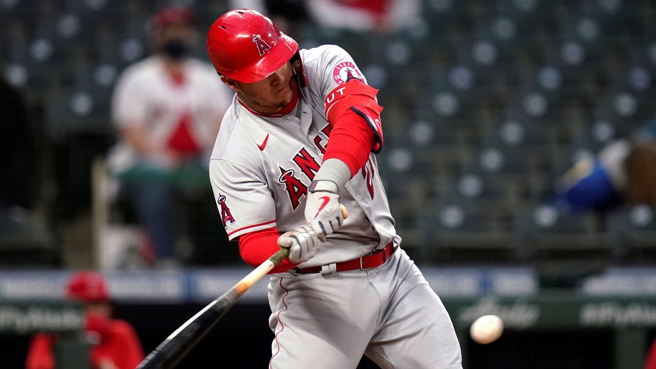 Los Angeles Angels' Mike Trout singles against the Seattle Mariners during the sixth inning of a baseball game Saturday in Seattle. (AP Photo/Elaine Thompson)