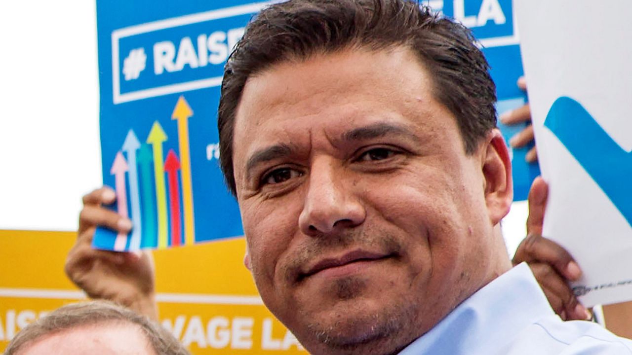 In this June 13, 2015, file photo Los Angeles City Councilman Jose Huizar is seen at the signing of a minimum-wage ordinance at Martin Luther King Jr. Park in Los Angeles. (AP Photo/Ringo H.W. Chiu, File)