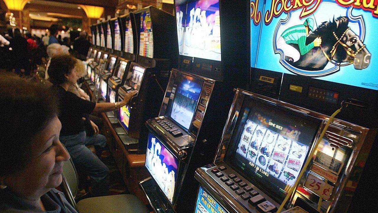 Gamblers play slot machines at Pechanga Resort & Casino, Temecula, California, photo