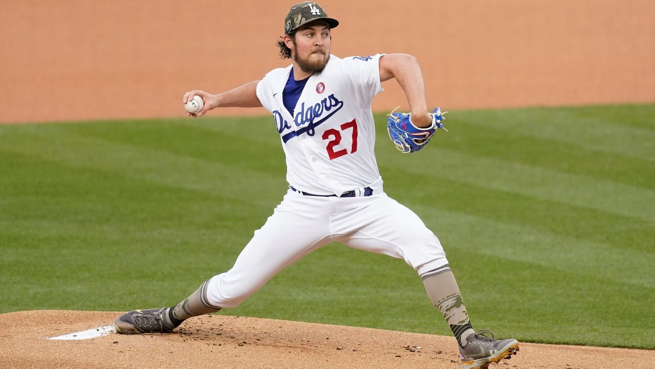 Los Angeles Dodgers starting pitcher Trevor Bauer (27) throws during the first inning of a baseball game Saturday against the Miami Marlins in Los Angeles. (AP Photo/Ashley Landis)