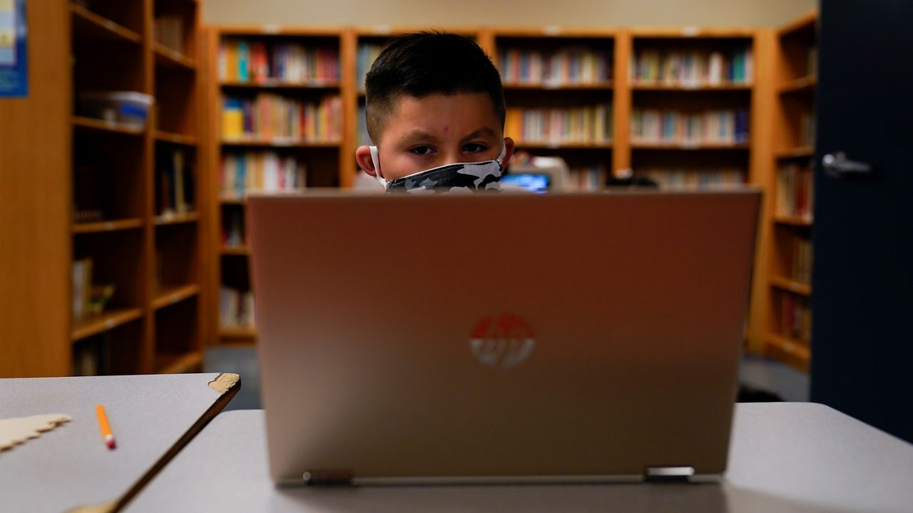 In this Aug. 26, 2020, file photo, a Los Angeles Unified School District student attends an online class at Boys & Girls Club of Hollywood in Los Angeles. (AP Photo/Jae C. Hong)