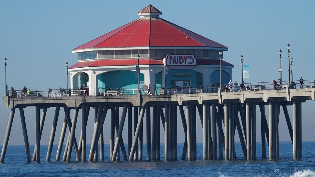 This Nov. 15, 2020, file photo shows the pier in Huntington Beach, Calif. (AP Photo/Damian Dovarganes)
