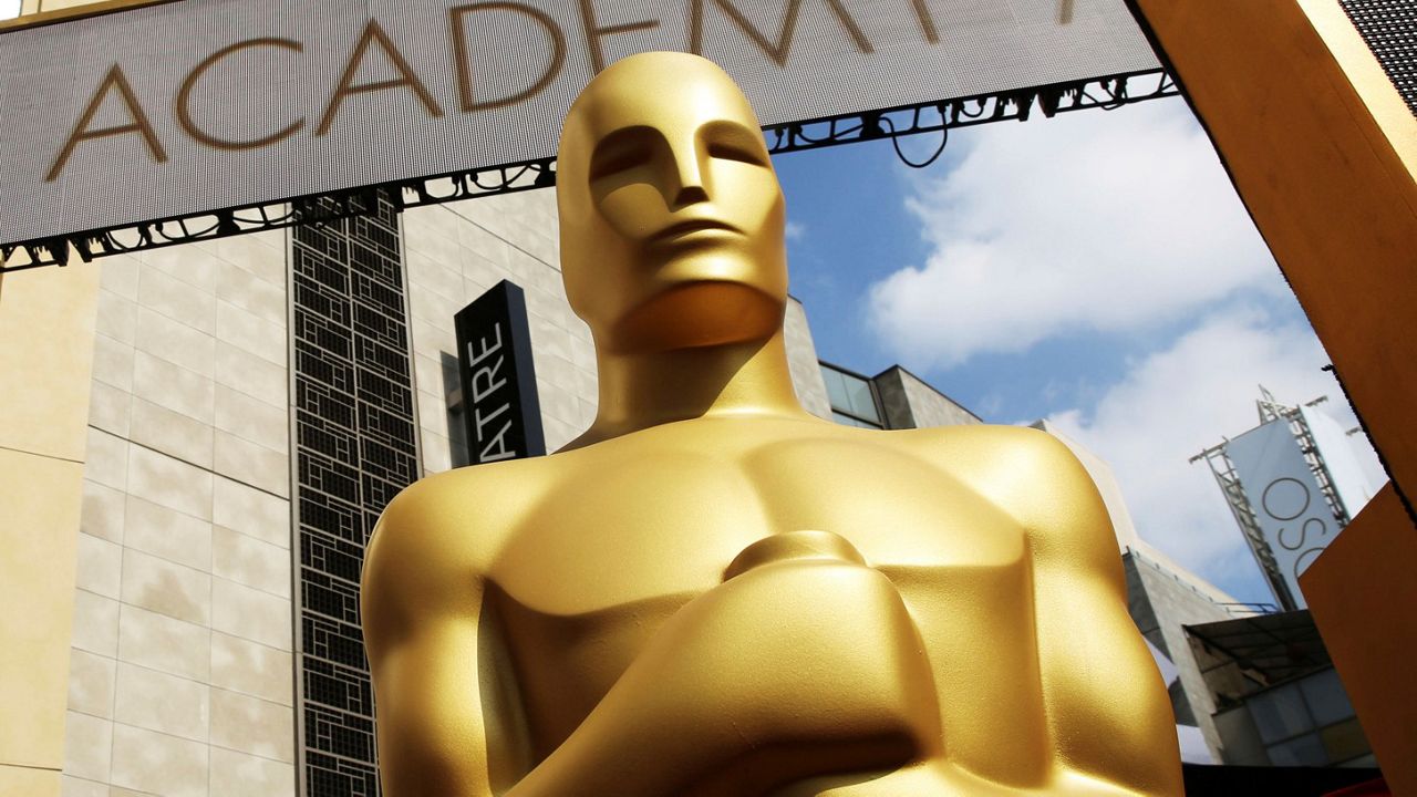 In this Feb. 21, 2015, file photo, an Oscar statue appears outside the Dolby Theatre for the 87th Academy Awards in Los Angeles. The 94th Oscars will be held on March 27, 2022. (Photo by Matt Sayles/Invision/AP, File)