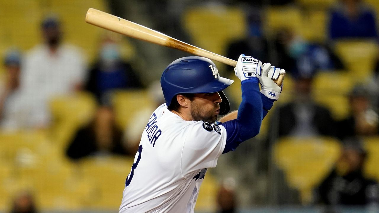 Los Angeles Dodgers' Chris Taylor drives in a run with a single during the fifth inning of a baseball game Friday against the San Francisco Giants in Los Angeles. (AP Photo/Marcio Jose Sanchez)