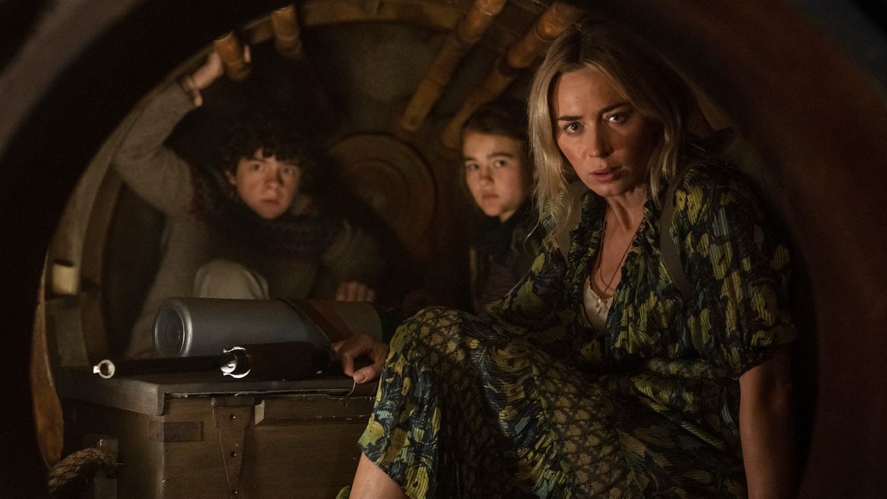 This image released by Paramount Pictures shows, from left, Noah Jupe, Millicent Simmonds and Emily Blunt in a scene from "A Quiet Place Part II." (Jonny Cournoyer/Paramount Pictures via AP)