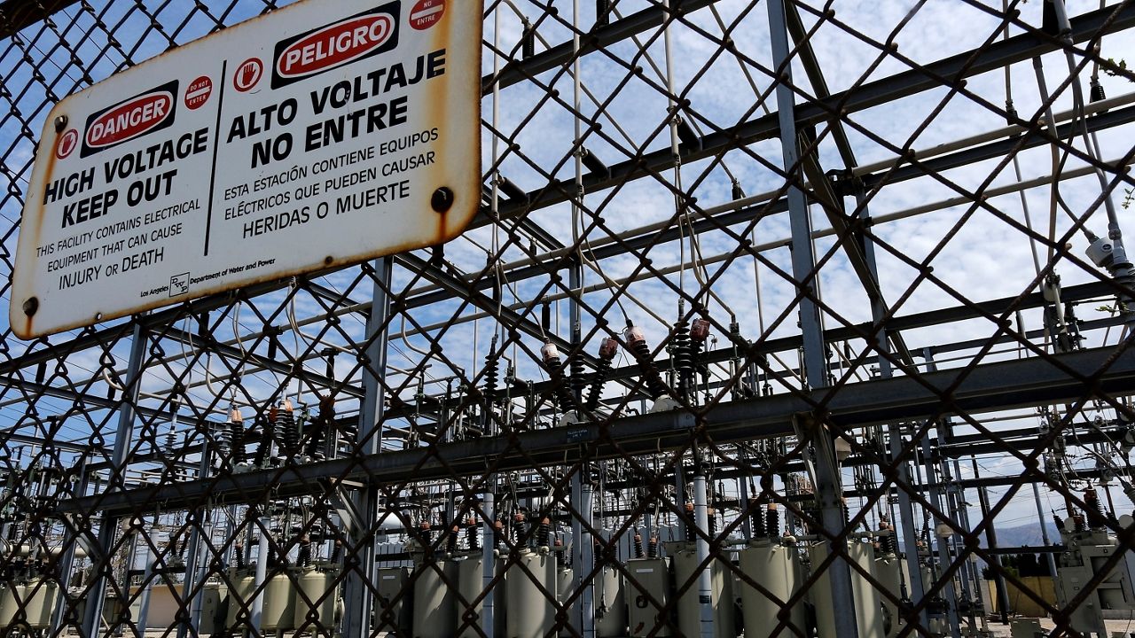High voltage signs are posted on the Department of Water and Power Sub Station E in the North Hollywood section of Los Angeles. (AP Photo/Richard Vogel)