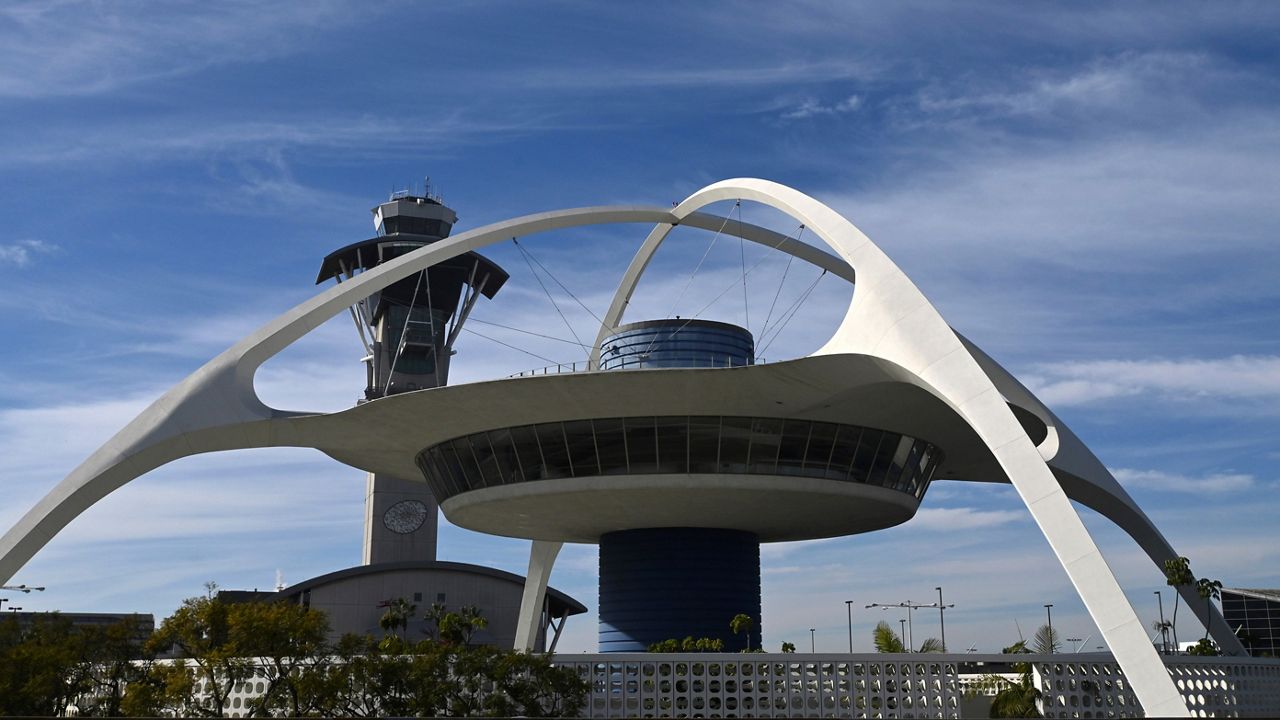 General overall view of the Theme Building and air traffic control tower at Los Angeles International Airport in Los Angeles. (Kirby Lee via AP)
