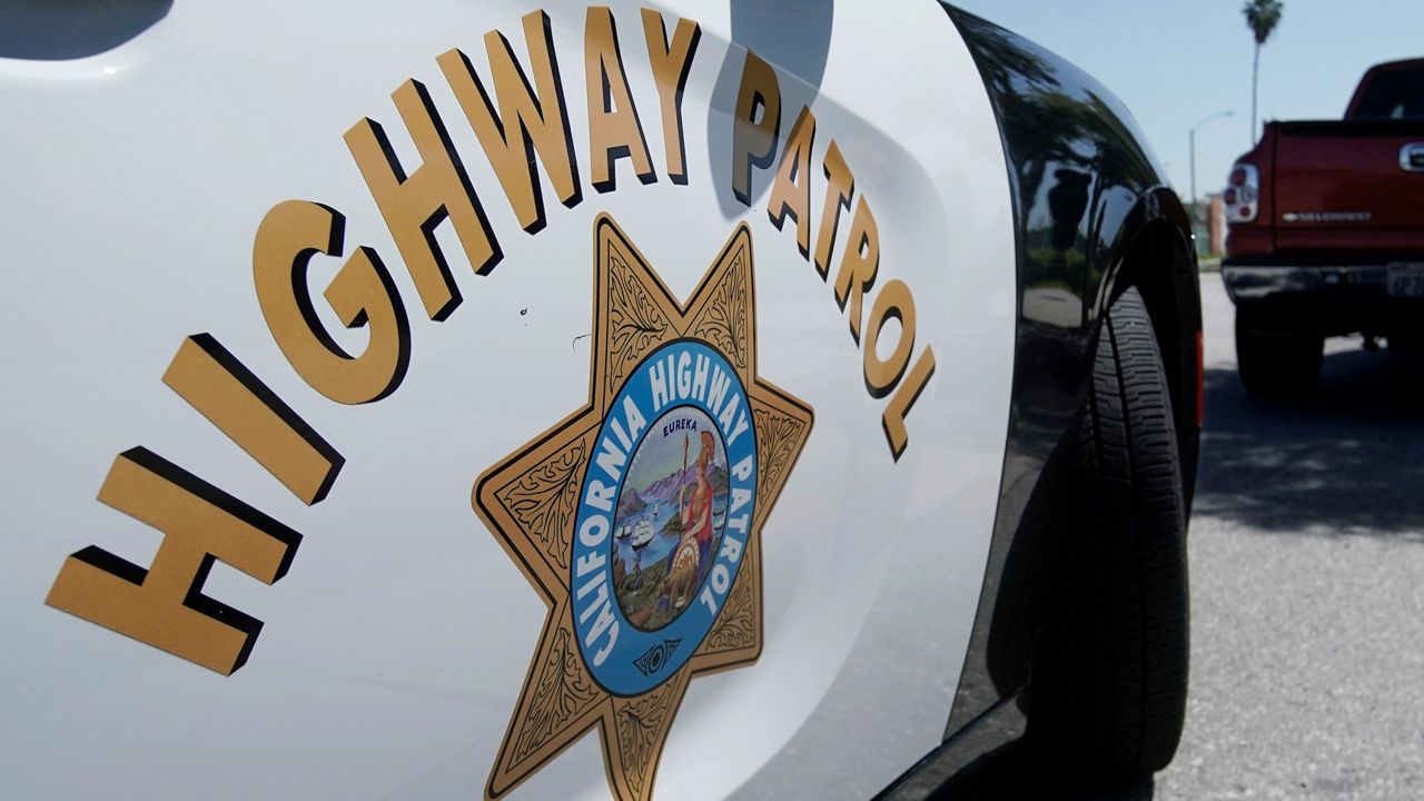 In this April 23, 2020 file photo, a California Highway Patrol officer stops a motorist in Anaheim, Calif. (AP Photo/Chris Carlson)