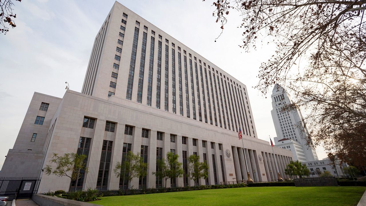 This Jan. 8, 2020, file photo shows the United States Court House building, known as Spring Street Courthouse, in downtown Los Angeles. Los Angeles City Hall is at right. (AP Photo/Damian Dovarganes)