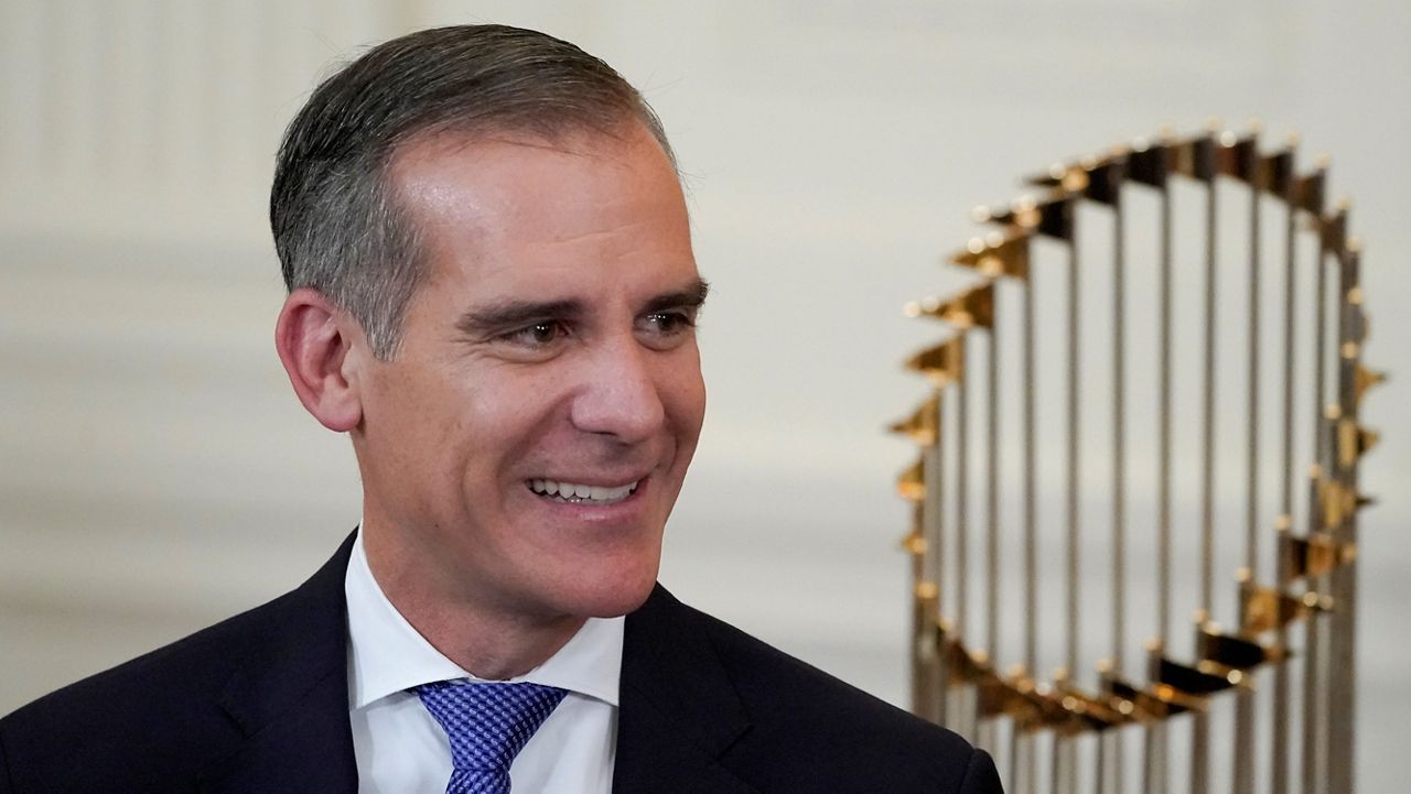 Los Angeles Mayor Eric Garcetti arrives for an event to honor the 2020 World Series champion Los Angeles Dodgers baseball team at the White House, Friday, July 2, 2021, in Washington. (AP Photo/Julio Cortez)