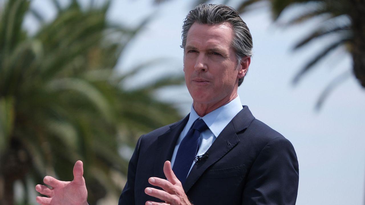 In this June 15, 2021, file photo, California Governor Gavin Newsom talks during a news conference at Universal Studios in Universal City, Calif. (AP Photo/Ringo H.W. Chiu)