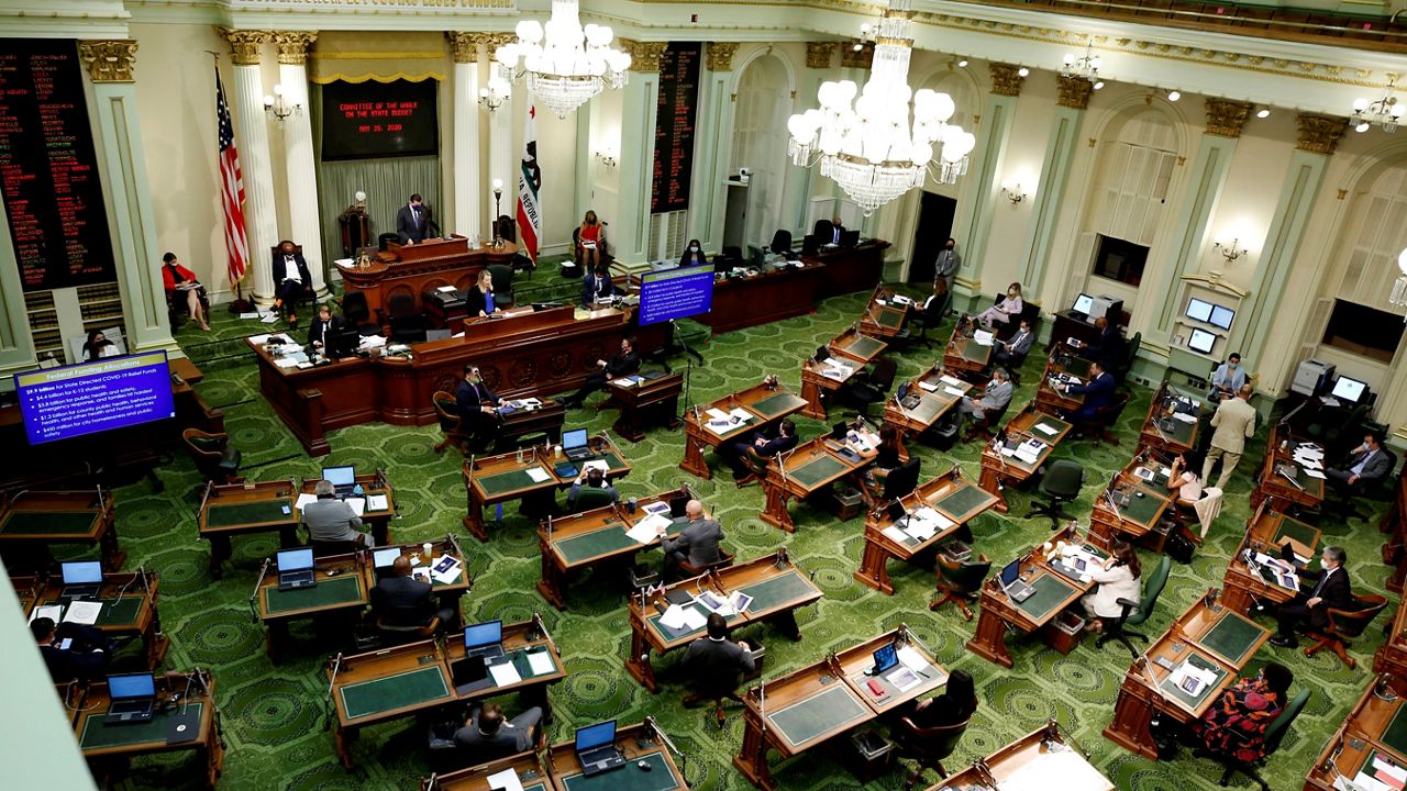 In this May 26, 2020, file photo, members of the state Assembly meet at the Capitol in Sacramento, Calif. On Thursday, California lawmakers voted on a bill that would fund guaranteed income programs across the state.  (AP Photo/Rich Pedroncelli)