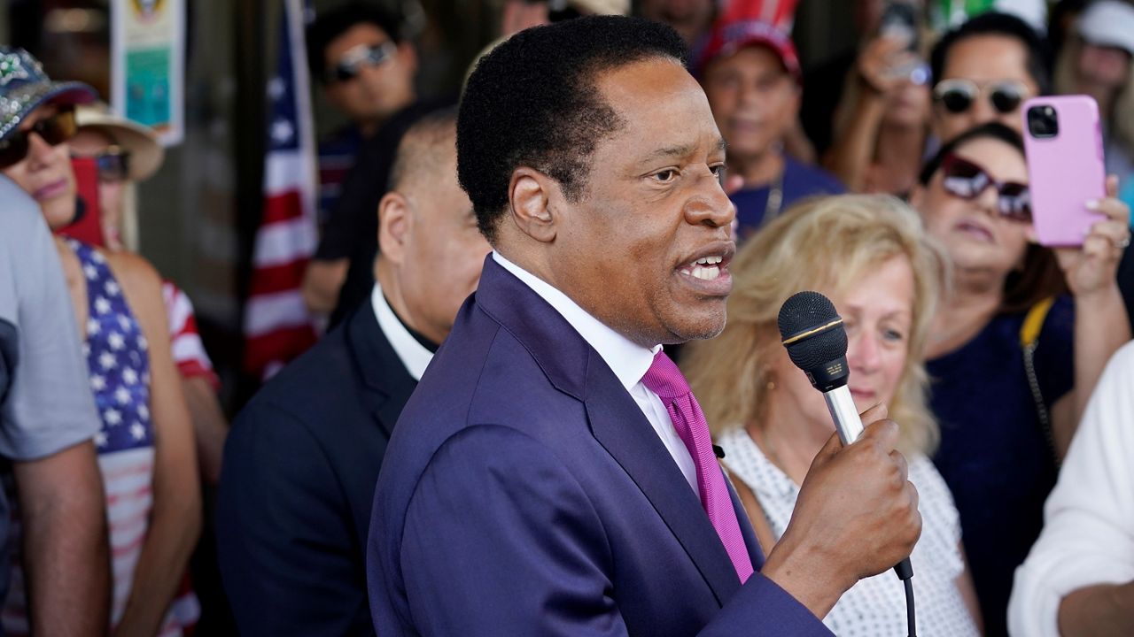 In this July 13, 2021, file photo, conservative radio talk show host Larry Elder speaks to supporters during a campaign stop in Norwalk, Calif. (AP Photo/Marcio Jose Sanchez)