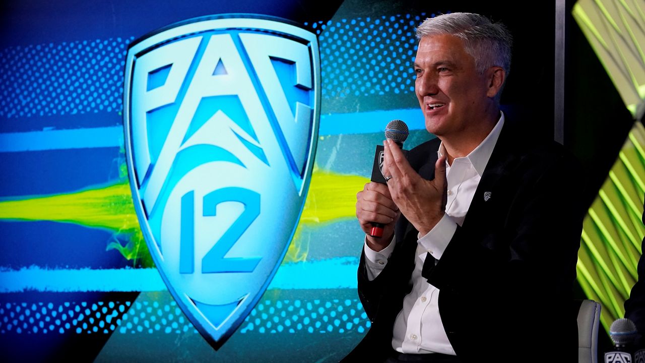 In this July 27, 2021, file photo, Pac-12 Commissioner George Kliavkoff fields questions during the Pac-12 Conference NCAA college football Media Day in Los Angeles. (AP Photo/Marcio Jose Sanchez)