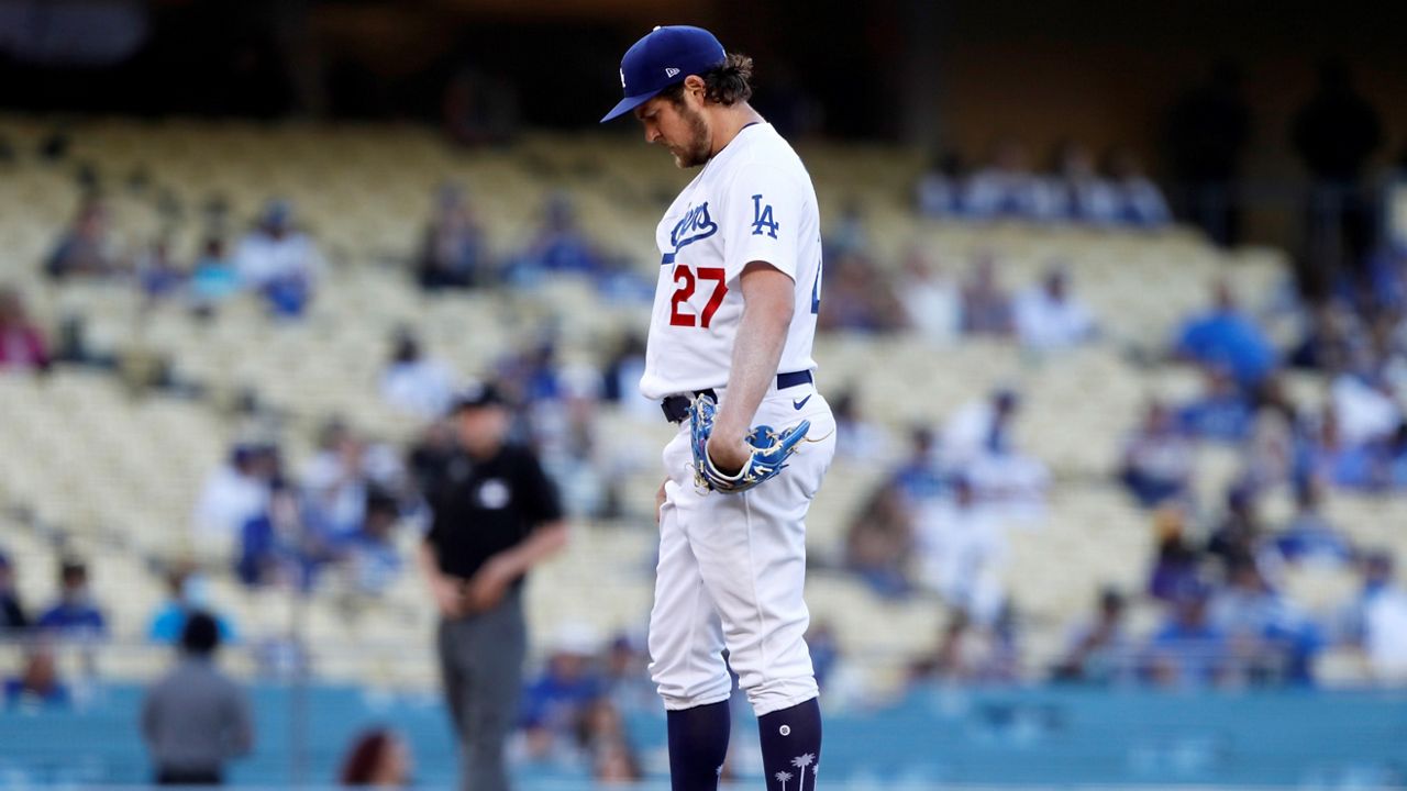 In this June 12, 2021, file photo, Los Angeles Dodgers starting pitcher, Trevor Bauer gathers himself at the mound before a baseball game against the Texas Rangers in Los Angeles. (AP Photo/Alex Gallardo)