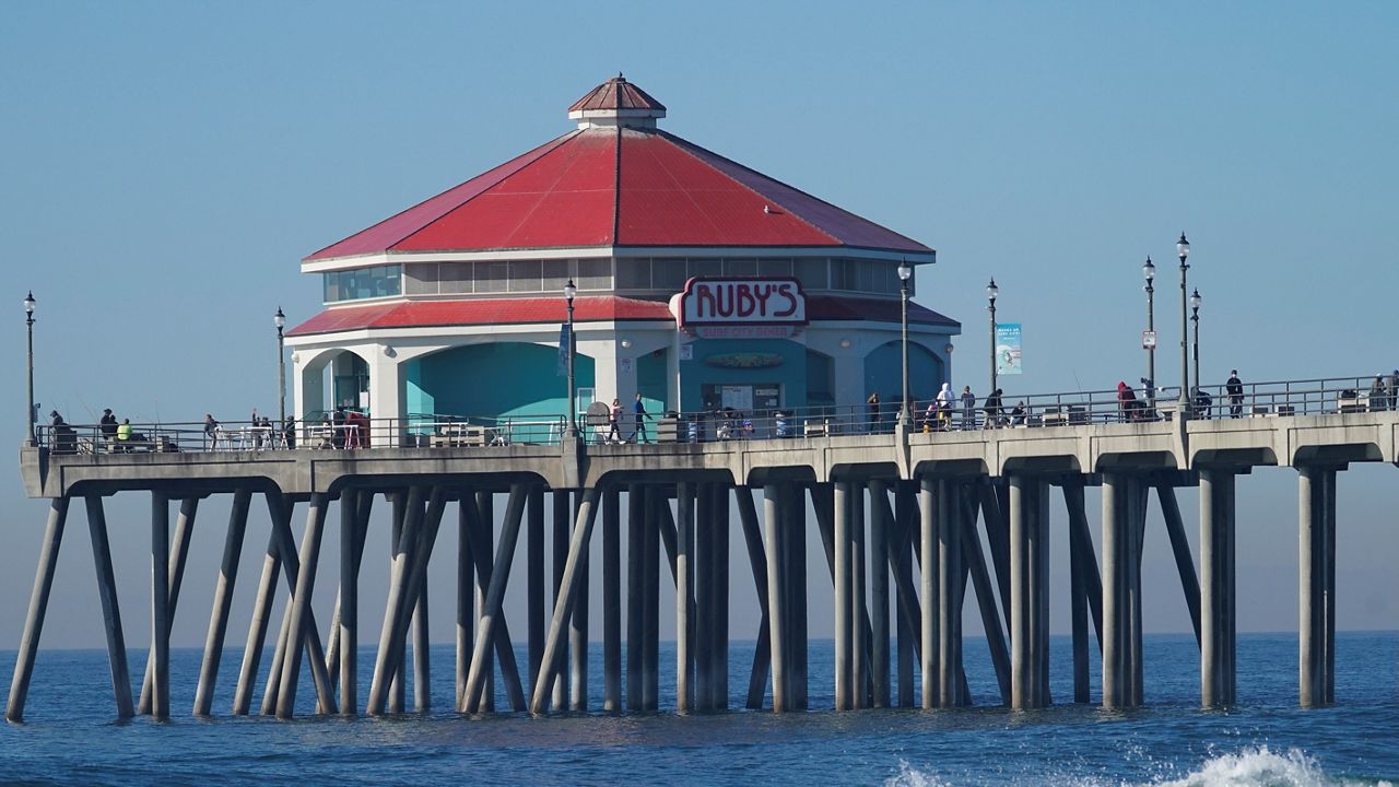 This Nov. 15, 2020, file photo shows the pier in Huntington Beach, Calif. (AP Photo/Damian Dovarganes)
