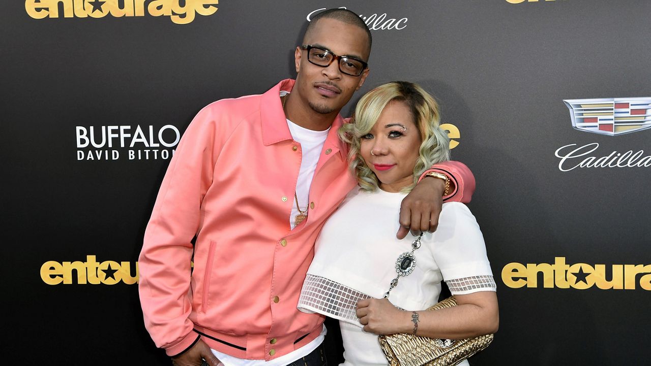 In this June 1, 2015, file photo, T.I., left, and Tiny Harris arrive at the Los Angeles premiere of "Entourage" at the Westwood Regency Village Theatre. (Photo by Rob Latour/Invision/AP)